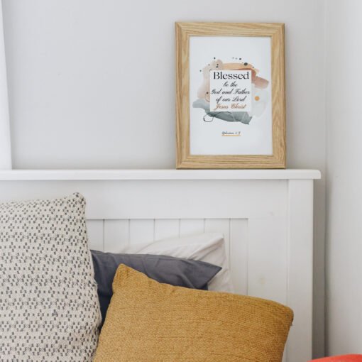 Blessed in faith wall art placed above the white bed frame
