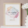 Do Everything in Love Wall Art on the beige wall, white flowers next to it