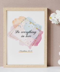 Do Everything in Love Wall Art on the beige wall, white flowers next to it