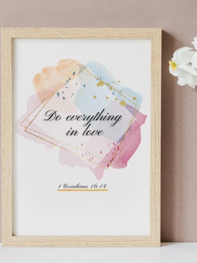 Do Everything in Love Wall Art on the beige wall, white flowers next to it