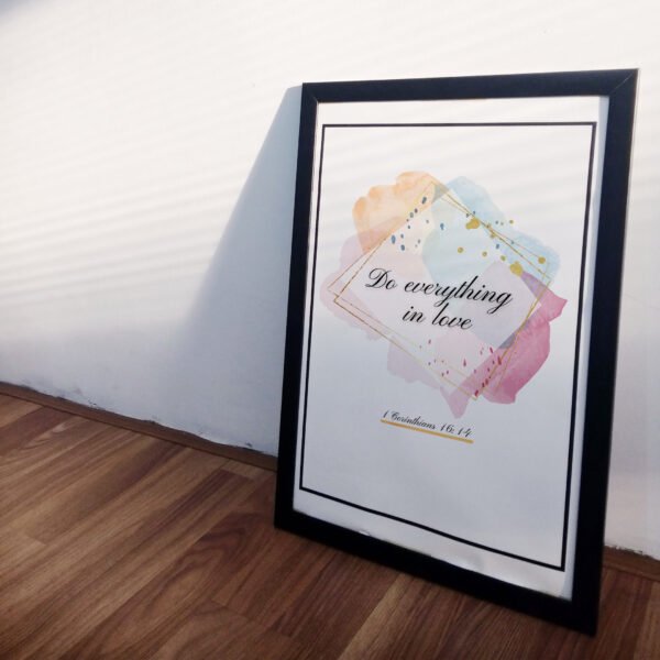 Do Everything in Love Wall Art leaning on the white wall