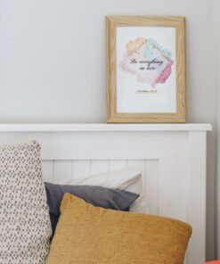 Do Everything in Love Wall Art in the living room, above the white bed with a yellow pillow