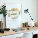 John 3:16 Wall Art on a wooden desk next to a laptop and a small palm tree