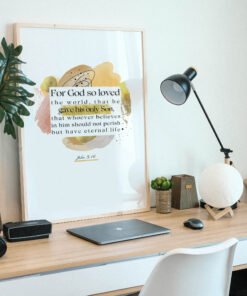 John 3:16 Wall Art on a wooden desk next to a laptop and a small palm tree