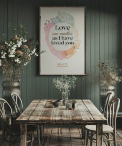 Love One Another Wall Art hung on the kitchen wall above a gray table