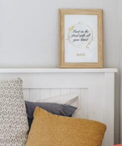 Trust in the Lord Wall Art hung above a bed in a white bedroom