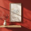 Trust in the Lord Wall Art on the red wall, ceramic vase with plants next to it