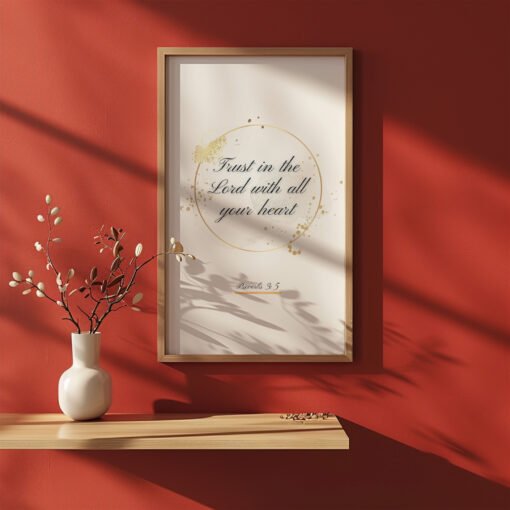 Trust in the Lord Wall Art on the red wall, ceramic vase with plants next to it