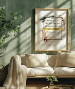 eternal life wall art hung in a living room next to a small tree