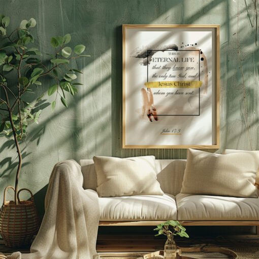 eternal life wall art hung in a living room next to a small tree