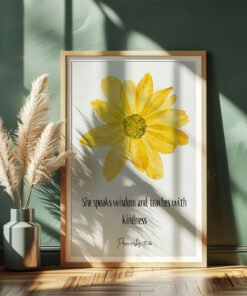 floral proverbs 31 wall art leaning on a dark green wall, beige plants next to it