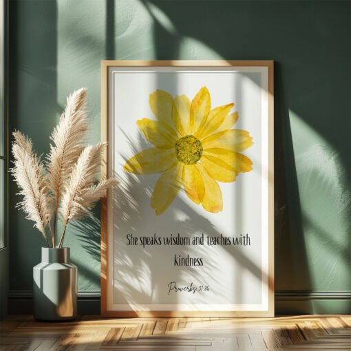 floral proverbs 31 wall art leaning on a dark green wall, beige plants next to it