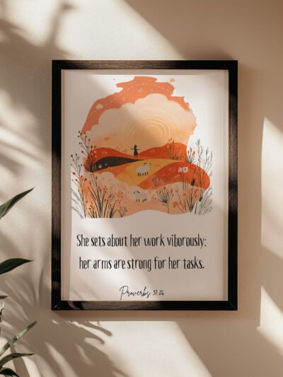 proverbs 31:26 wall art in a black frame on the beige wall