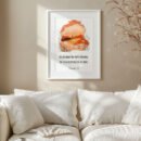 proverbs 31:26 wall art in a white frame hung o n the white wall above the white sofa