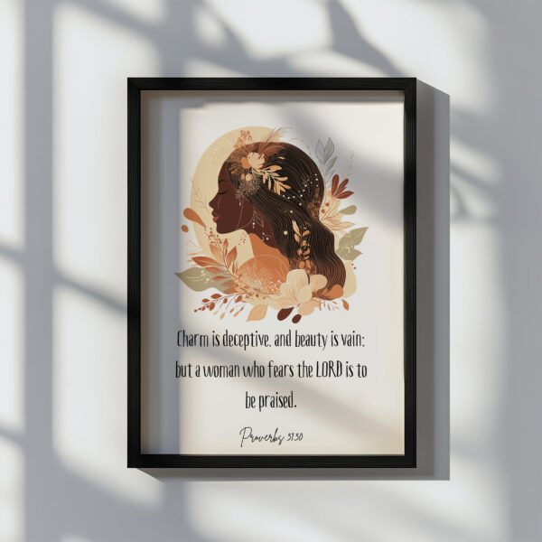 proverbs 31:30 wall art in a black frame hung on the white wall