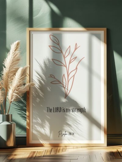 psalm 118 wall art leaning on a dark green wall, beige plants next to it