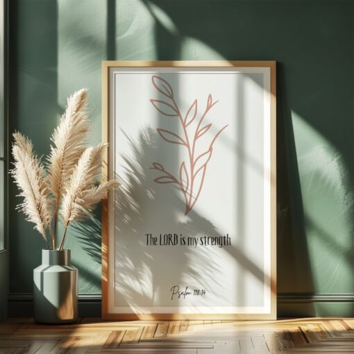 psalm 118 wall art leaning on a dark green wall, beige plants next to it