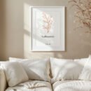 psalm 118 wall art in a white frame hung above a white sofa