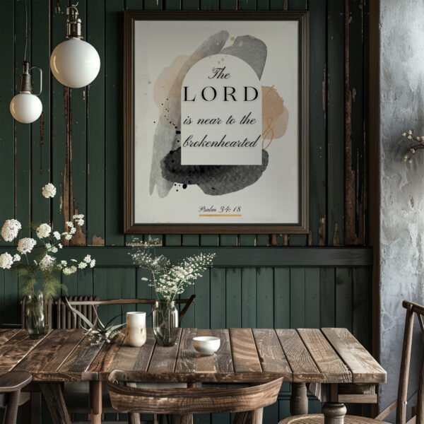 Psalm 34 wall art in a black frame hung in a dark green kitchen above the wooden table