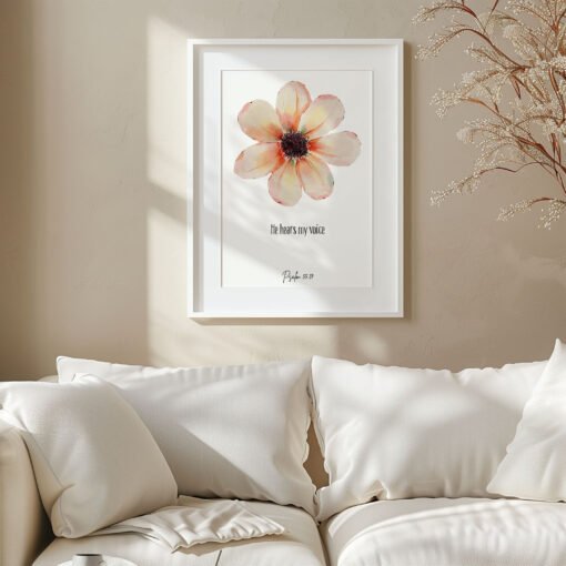white frame with psalm 55 wall art hung on a wall above a white sofa